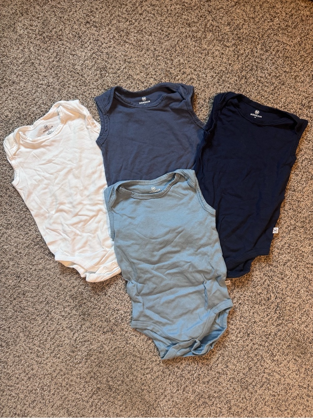 The Honest Company Baby One-Piece Set in White, Light Blue, Navy, Dark Blue